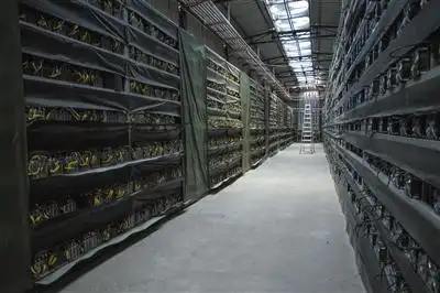 Optimized UK mining farm hosting facility with rows of mining rigs
